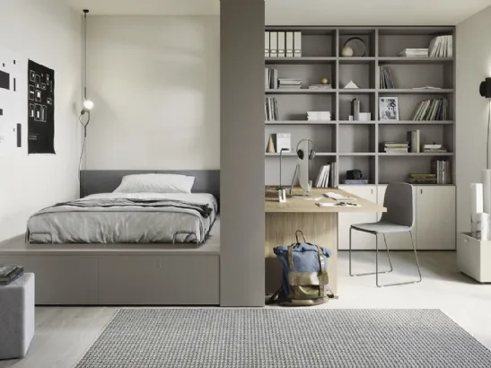 Cameretta componibile con letto su cassettone, scrivania e ampia libreria Next space 02 di Nidi